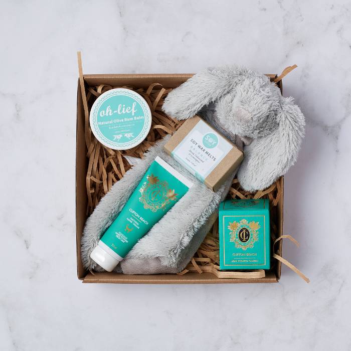 Little Bundle of Joy Gift Box with Oh-Lief balm, plush grey bunny, soy wax melts, and hand cream.