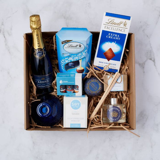 Daydream Delight Gift Set with Krone Rosé MCC, Lindt chocolates, Soy candle, and aromatherapy oils beautifully packaged.