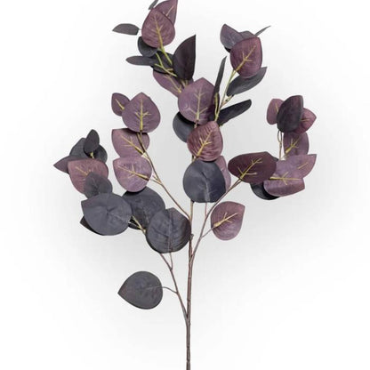 A single stem of burgundy eucalyptus artificial foliage with detailed leaves, showcasing the lifelike design against a white background.