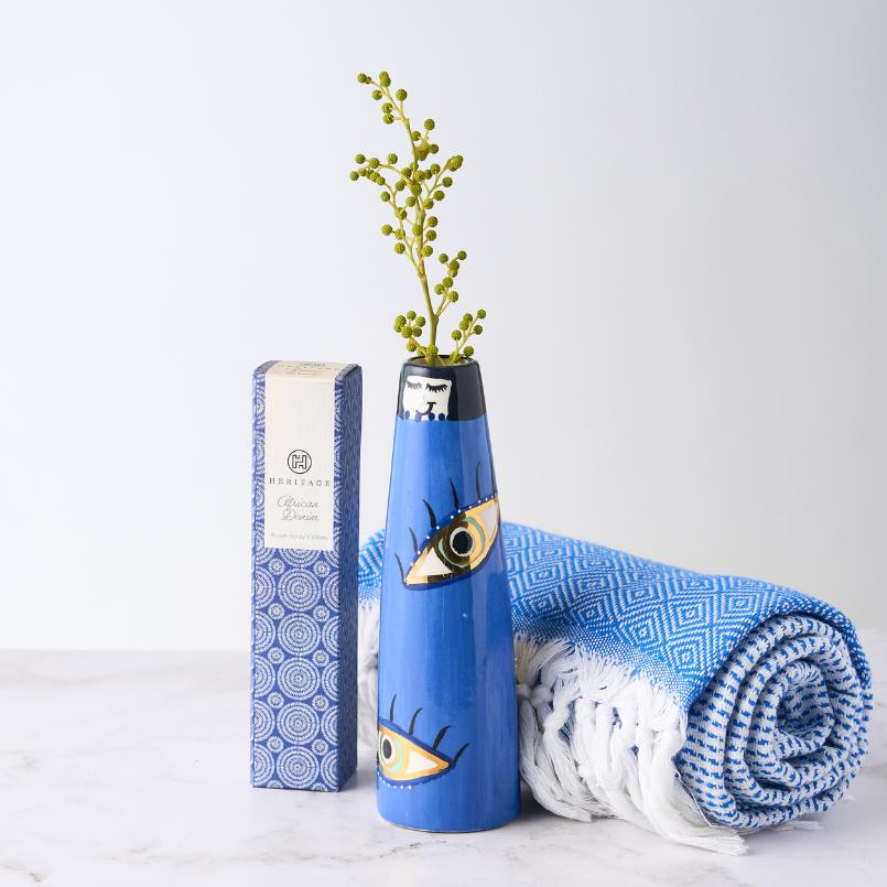 yeland Holiday Gift Set by Flower Guy, featuring a blue evil eye motif vase, a Turkish towel with a geometric pattern, and a Heritage room spray.