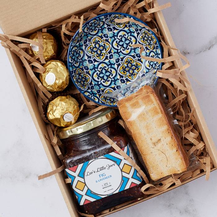 Gourmet Fig & Lavender Delight Gift Box featuring luxurious preserve, Ferrero Rocher chocolates, and handcrafted ceramic bowl.