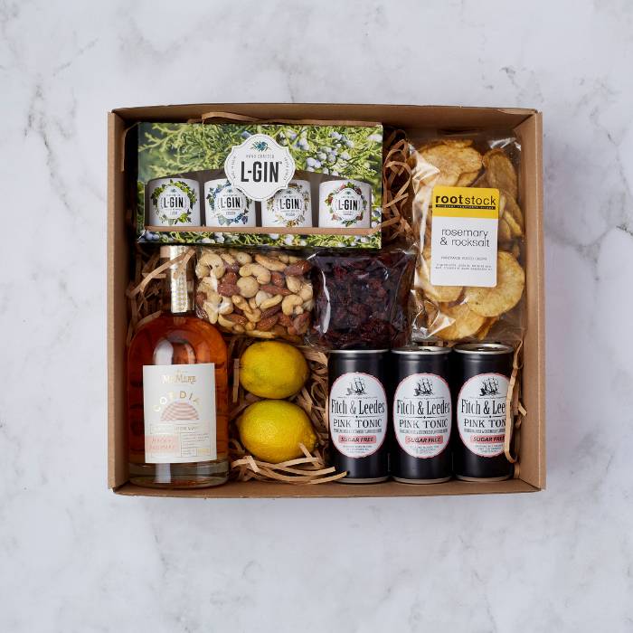 Gin for the Win gift box featuring artisanal gin miniatures, pink tonic, rosemary crisps, and gourmet snacks.