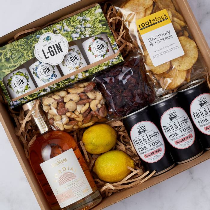 Premium gin gift set with L-Gin miniatures, Fitch & Leedes tonic, and savoury snacks, beautifully packaged for gifting.