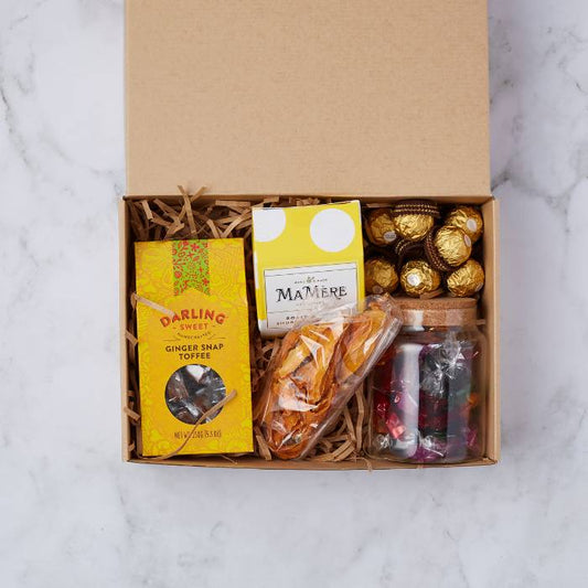 Ginger Snap & Gold Box gourmet hamper by Flower Guy featuring artisan ginger snap toffee, Ferrero Rocher, dried fruit, and luxury chocolates.