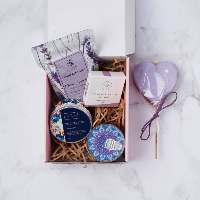 Lavender Bliss Gift Box with bath salts, shower steamer, body butter, mandala candle, and lavender cookie.