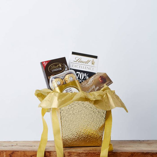 Luxe Chocolate Indulgence gift box from Flower Guy featuring Lindt chocolates, Ferrero Rocher, and a golden presentation.