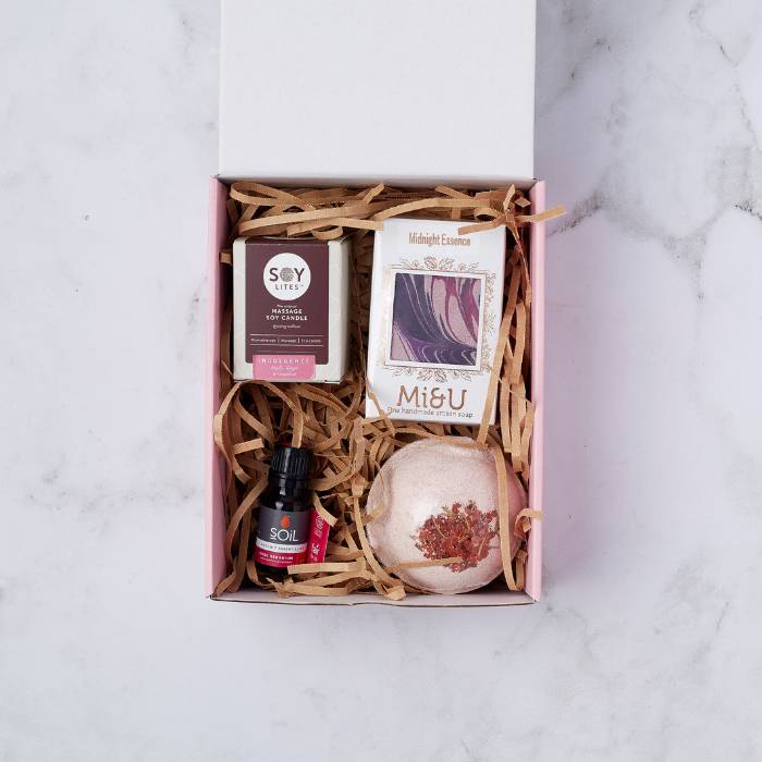 Luxe Living Gift Box with soy massage candle, artisan soap, rose essential oil, and bath bomb.