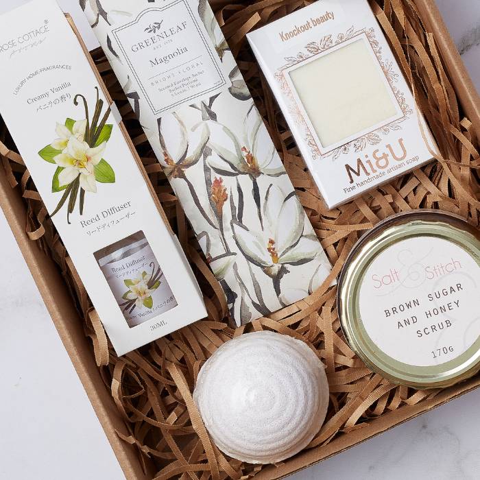 Close-up of Magnolia Spa Gift Box featuring aromatic spa essentials for a relaxing experience.