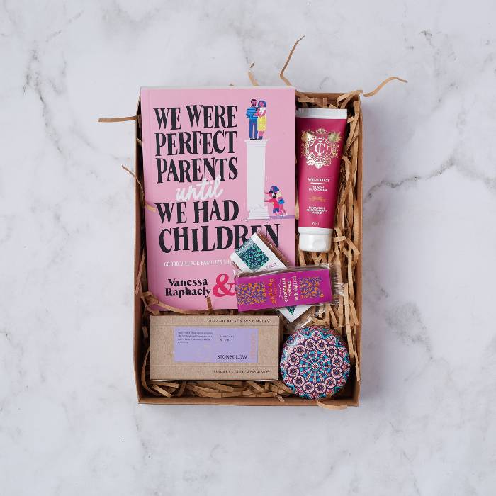 Parent's Pause Gift Box containing a parenting book, wild coast hand cream, wax melts, mandala tin candle, and chocolate treats.