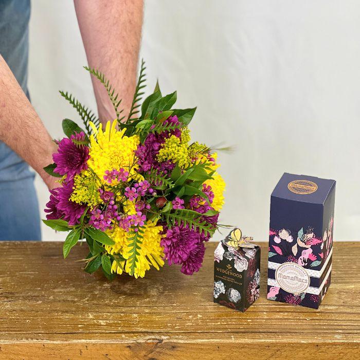 Peninsula Paradise Flower Bouquet with wax flowers and chrysanthemums and Gourmet Treats like nougat and chocolate - Flower Guy