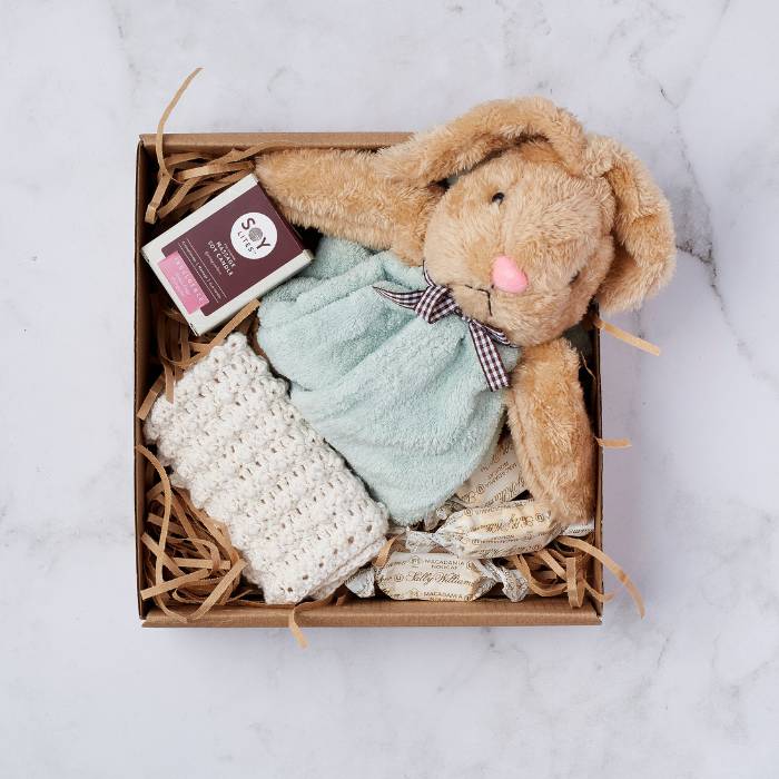 Rabbit Dudu Gift Box featuring a plush rabbit, crochet blanket, soy candle, and nougat treats in a box.