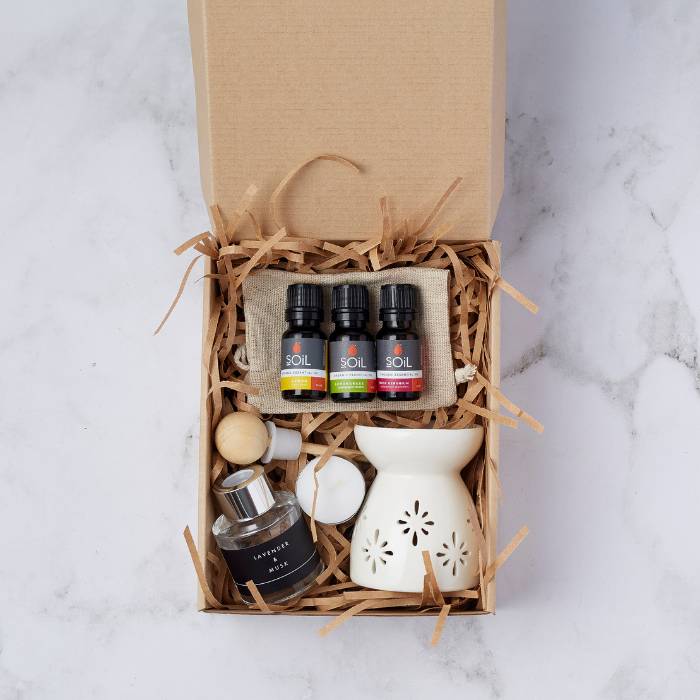 Home Fragrance Essentials Set featuring a ceramic burner, lavender and musk diffuser, tealight candles, and three SOiL organic fragrance oils.