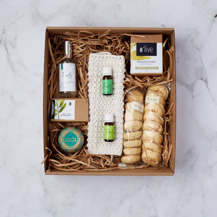 Spa Day at Home Gift Box featuring a curated selection of relaxation products like room spray, artisan soap, and scented candles.